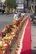 Thailand: A man at a long street altar awaits the procession of entranced devotees or 'Ma Song', Phuket Vegetarian Festival